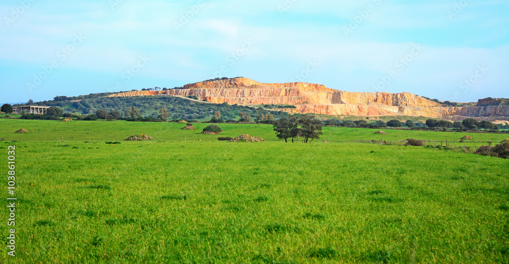 Fototapeta premium quarry and green field in Sardinia