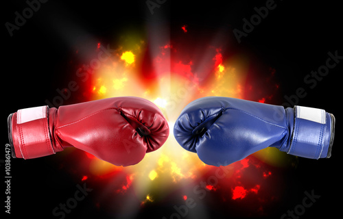 Boxing gloves Red and blue boxing gloves on explosion background. © wimage72