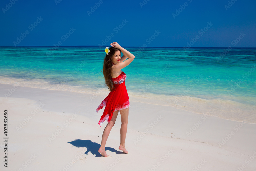 Wellness. Beautiful woman smiling on the beach. Young female in Wellness. Beautiful woman smiling on the beach. Young female in