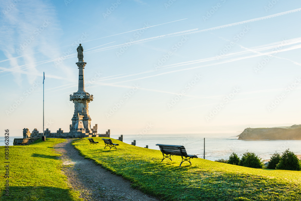 Comillas marquis monument facing the Cantabric sea and blue sky. Comillas, province of Santander, Spain