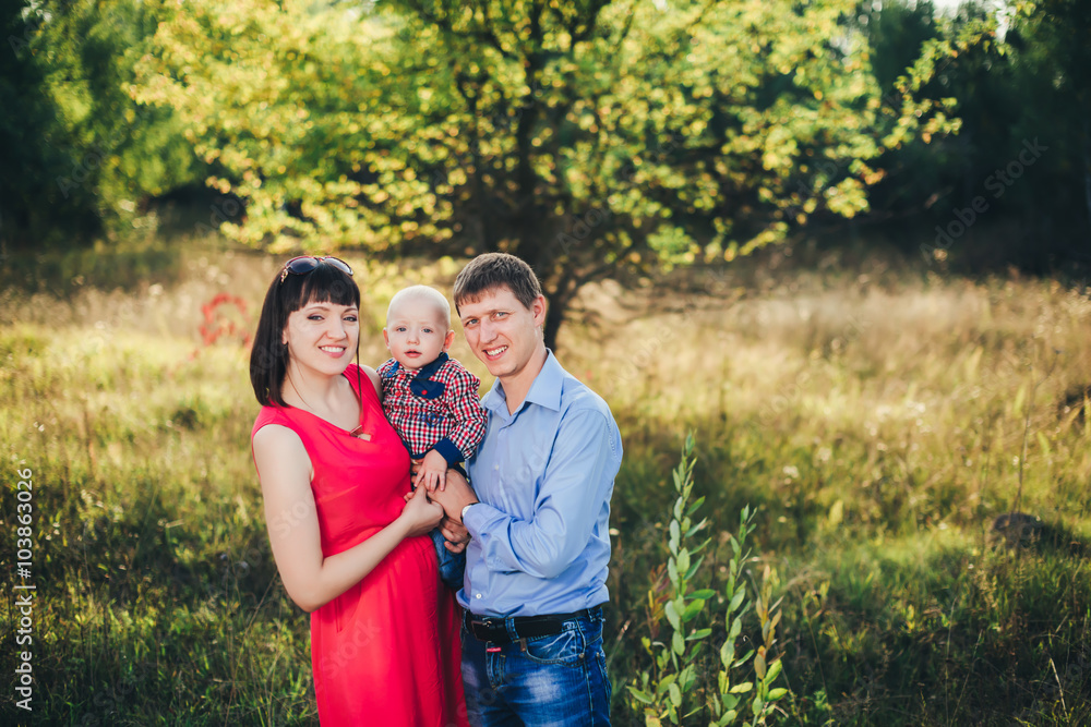 Pretty happy family for a walk in the park fall Pretty happy family for a walk in the park fall