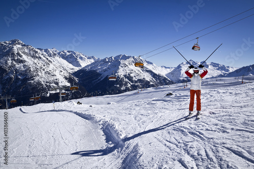 Young woman enjoying skiing in Solden, Austria