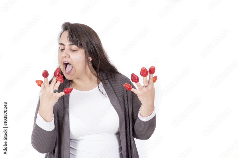 fat woman holding strawberryies on fingers and look funny fat woman holding strawberryies on fingers and look funny
