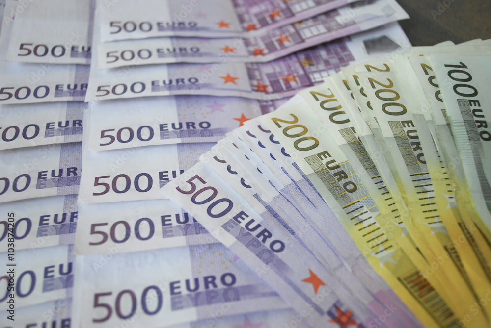 Fototapeta premium Cash Euro five hundred banknotes spread out on the table.