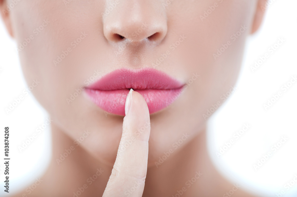 Obraz premium Pretty young woman is gesturing secretly