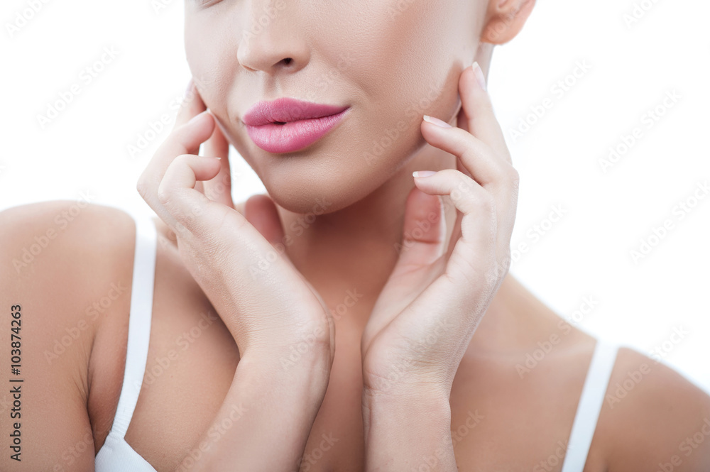 Cheerful healthy woman is caring of her skin Cheerful healthy woman is caring of her skin