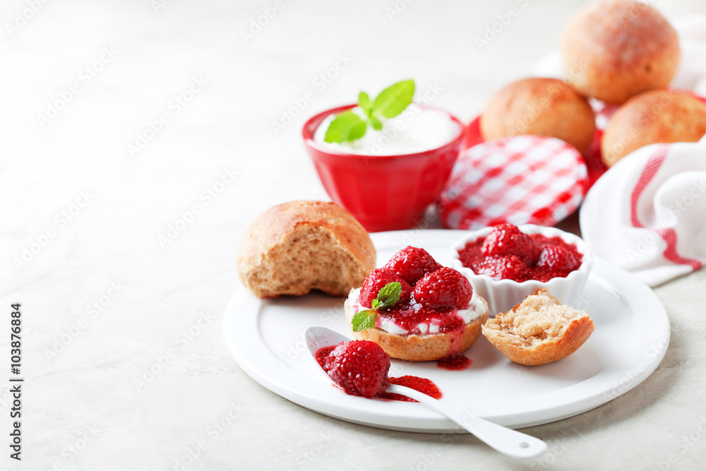 Wholegrain buns and chia seeds strawberry jam for breakfast, selective focus Wholegrain buns and chia seeds strawberry jam for breakfast, selective focus