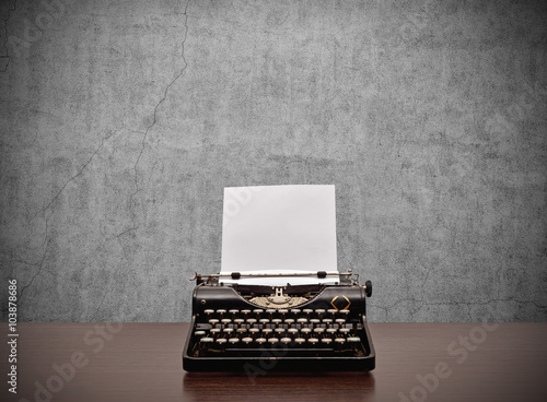 typewriter with blank paper