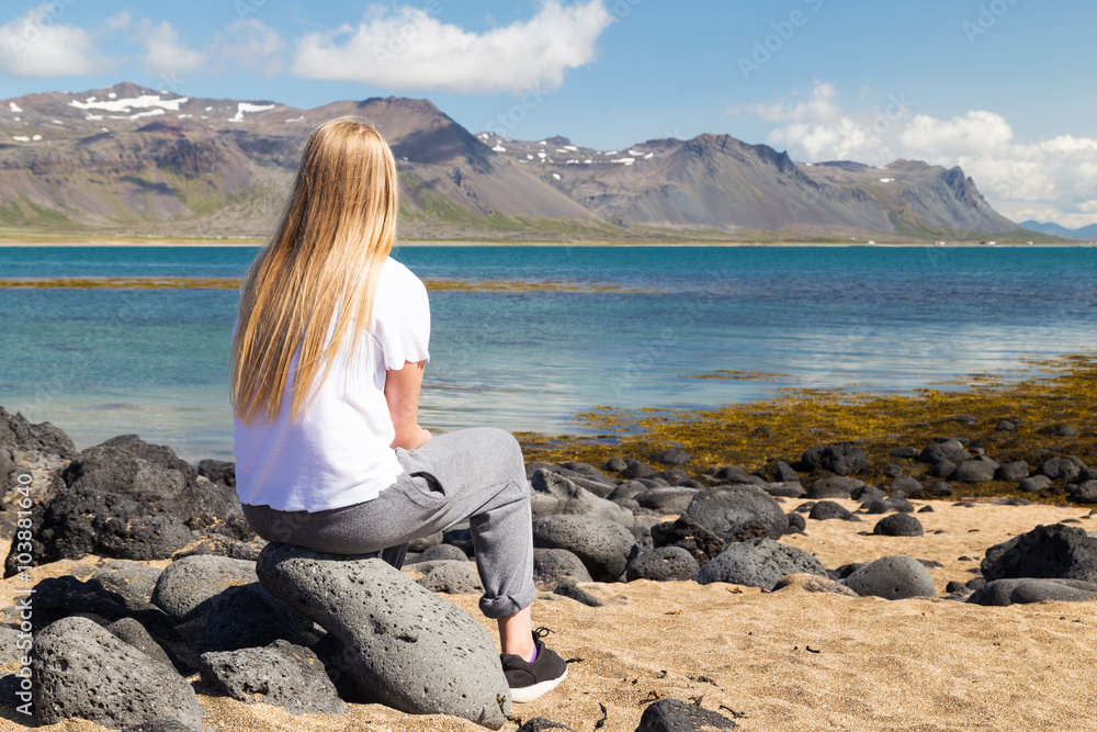 Girl looking out to sea