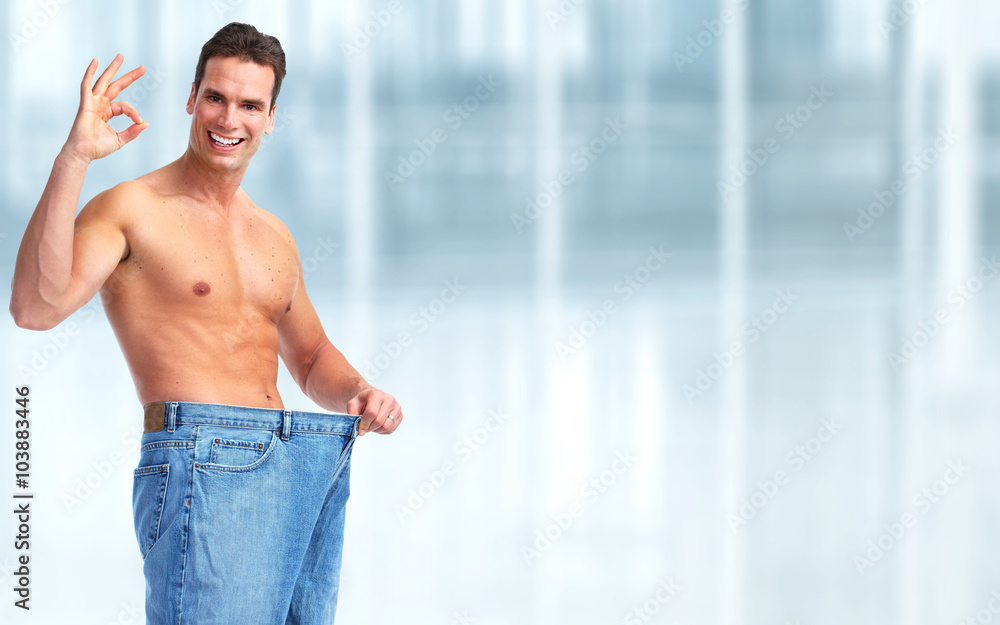 Fototapeta premium Slimming man with big size pants.
