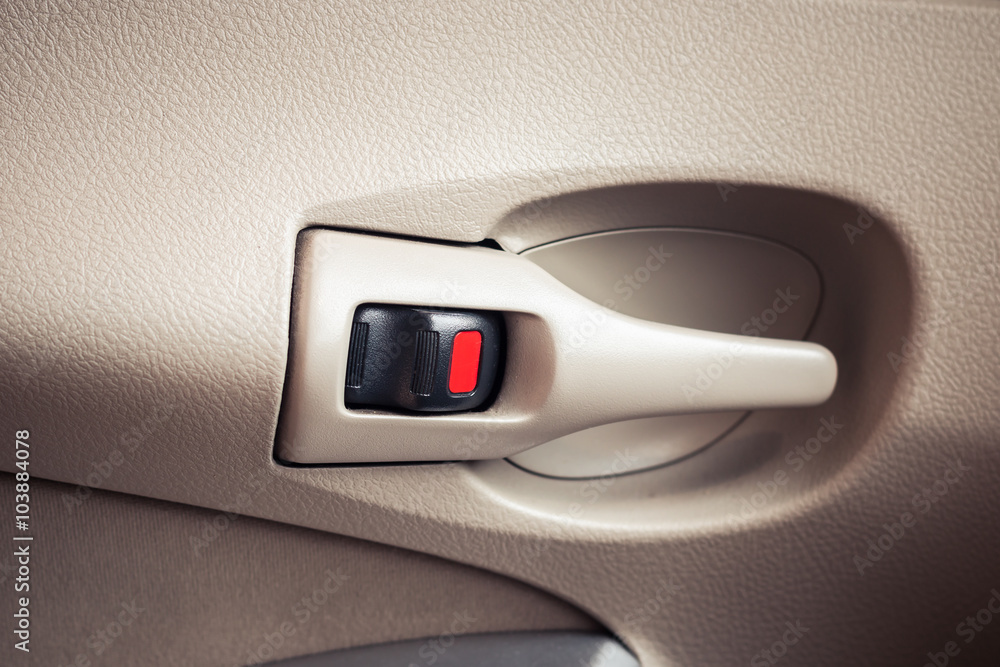 Central lock handle color red to lock the car door interior Central lock handle color red to lock the car door interior