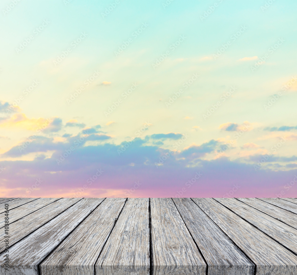 wooden floor and beautiful sunset or sunrise blurred background