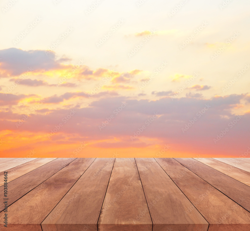  wooden floor and beautiful sunset or sunrise blurred background  