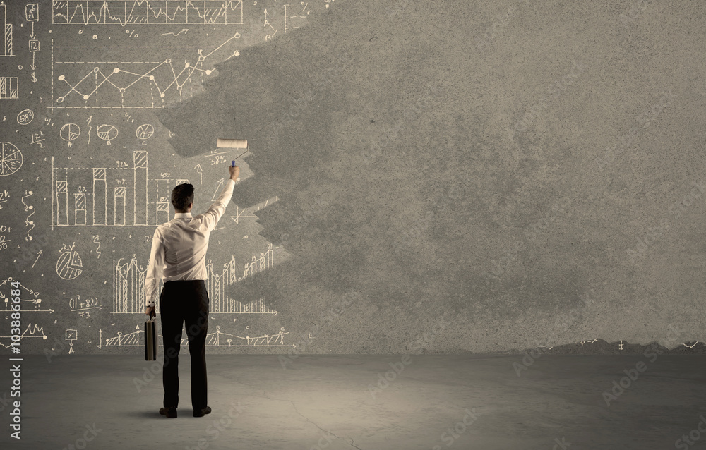 Salesman painting over charts on wall