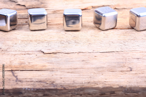 abstract background. steel cubes on a wooden surface
