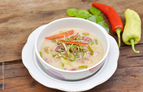 Sour and Sweet curry pickled pork with Thai spices in coconut milk. Moo Som soup of Thai food 

