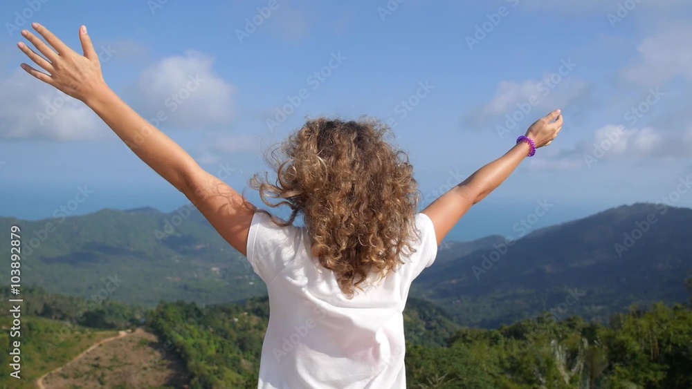 Young Woman Reaching the Top and Feeling Freedom Young Woman Reaching the Top and Feeling Freedom