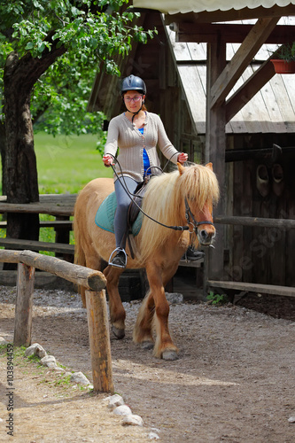 young woman on horseback