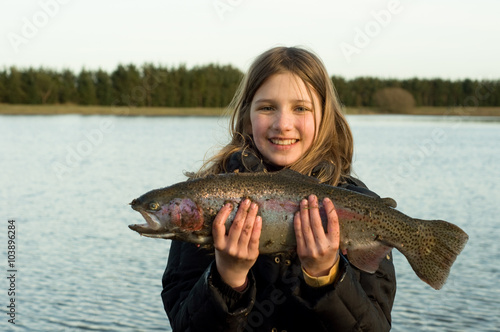 The child caught a trout