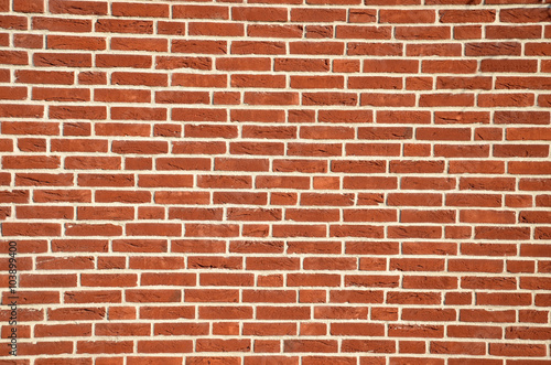 Wall made from red bricks as an background