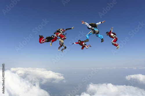 Quadro su tela Group of skydivers in freefall.