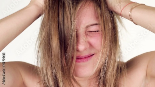Beautiful woman scratching her head.