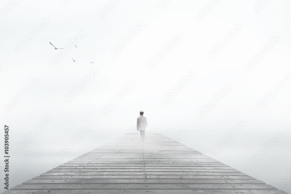 Man desappearing in the white fog Man desappearing in the white fog