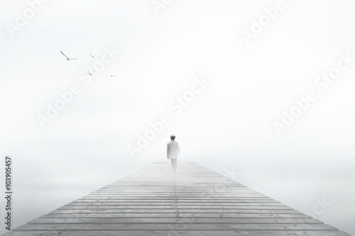 Fotografie, Obraz Man desappearing in the white fog