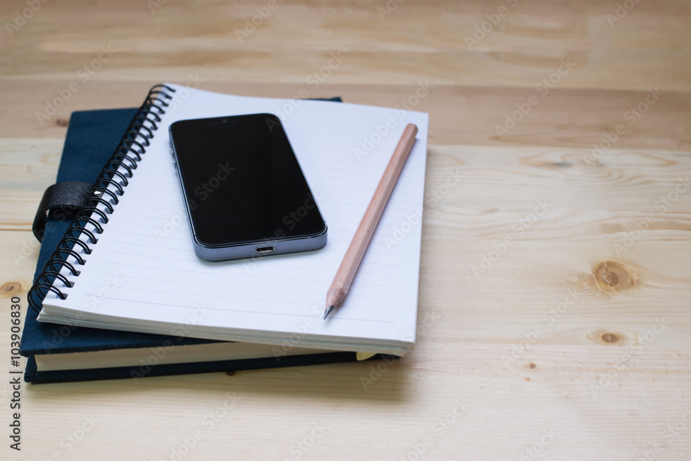 blank notebook on desk background. blank notebook on desk background.