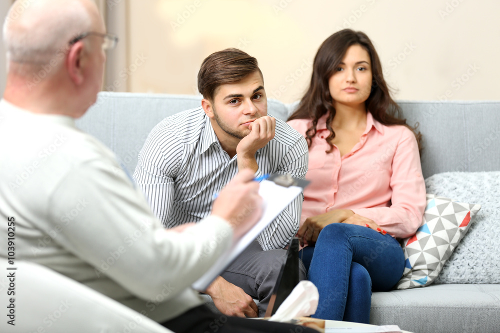 Young couple with problem on reception for family psychologist Young couple with problem on reception for family psychologist