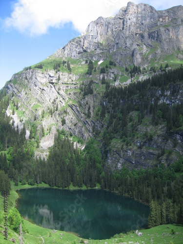 View down onto Hinterburgseeli lake near Axalp in the Bernese Oberland region of Switzerland photo