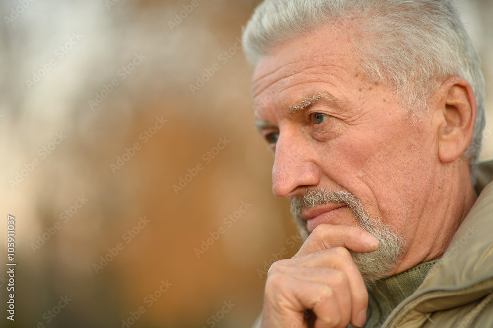 thoughtful senior man in park thoughtful senior man in park