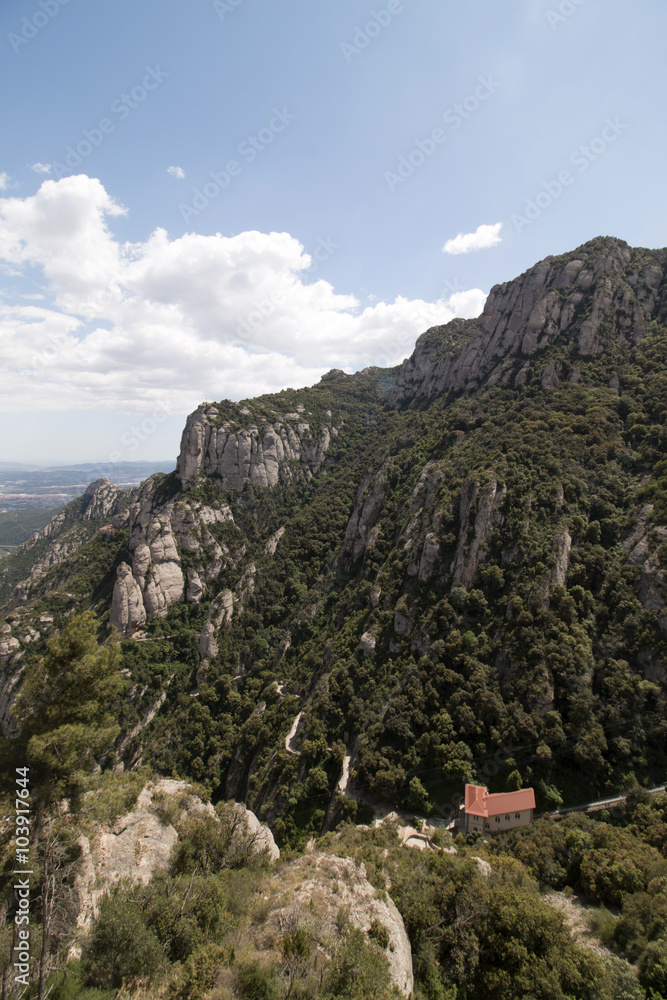 View of the beautiful mountains of Montserrat where a famous benedictine abbey is located near Barcelona city, Spain. View of the beautiful mountains of Montserrat where a famous benedictine abbey is located near Barcelona city, Spain.