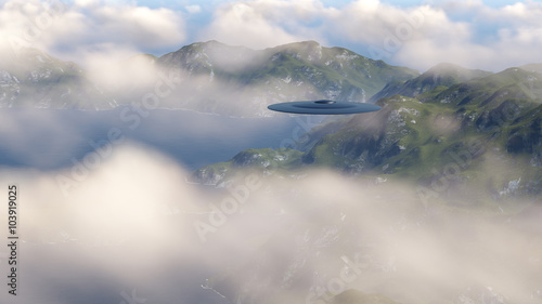 UFO over the mountains in the clouds