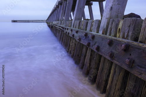 Schilderij op canvas South Pier, Blyth, Northumberland, England, UK, on very dull overcast day, long exposure and split tone colour processing
