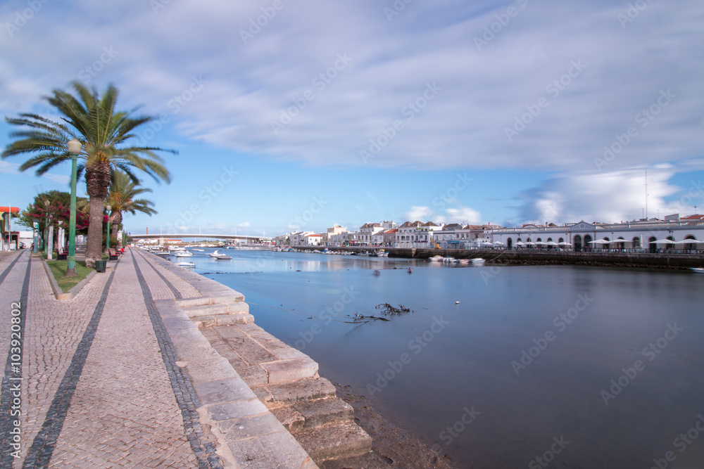 Wide view of the picturesque city of Tavira, Portugal, crossed by Gilao river.