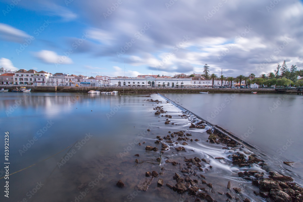 Wide view of the picturesque city of Tavira, Portugal, crossed by Gilao river.