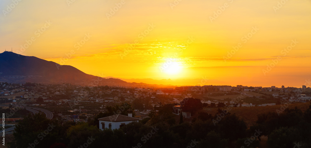 Panorama, panoramic view of sunset Over Mountains and town Mijas
