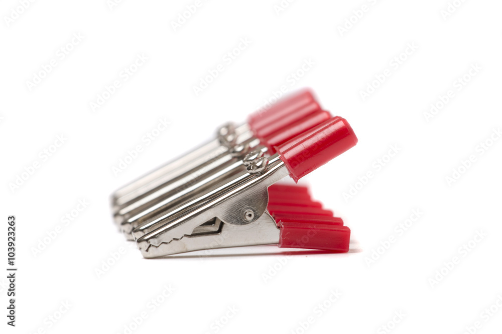 Alligator clippers on a white background. Alligator clippers on a white background.
