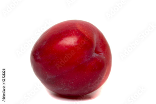 Tasty red plum fruit isolated on white background.