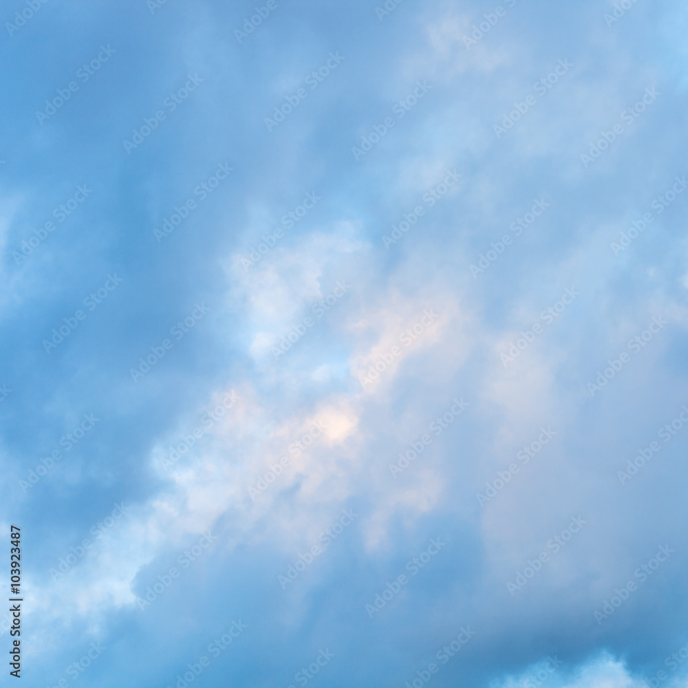 Fototapeta premium blue clouds in sunset sky in winter
