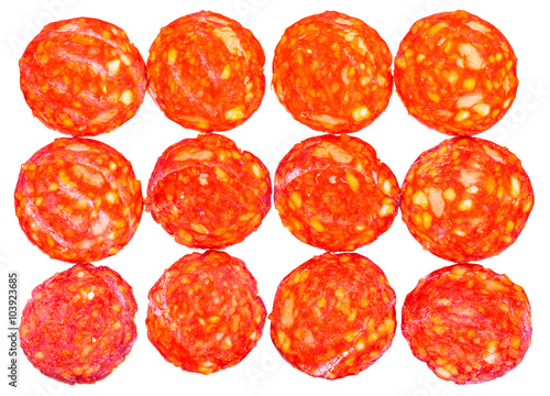 many slices of pepperoni salami isolated on white