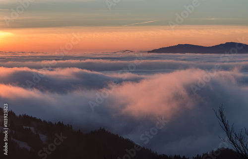 Carpathian mountains in the clouds, sunrise seen from Wysoka mountain in Pieniny, Poland © tomeyk