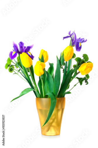 Fototapeta Naklejka Na Ścianę i Meble -  green chrysanthemums and yellow tulips with purple flower in white vase on an isolated background