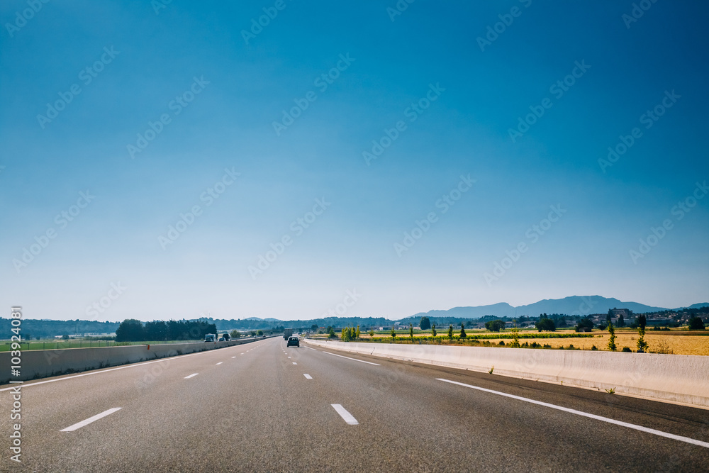 Beautiful asphalt road, freeway, motorway, highway under sunny b