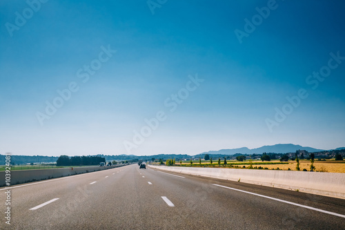 Beautiful asphalt road, freeway, motorway, highway under sunny b © Grigory Bruev