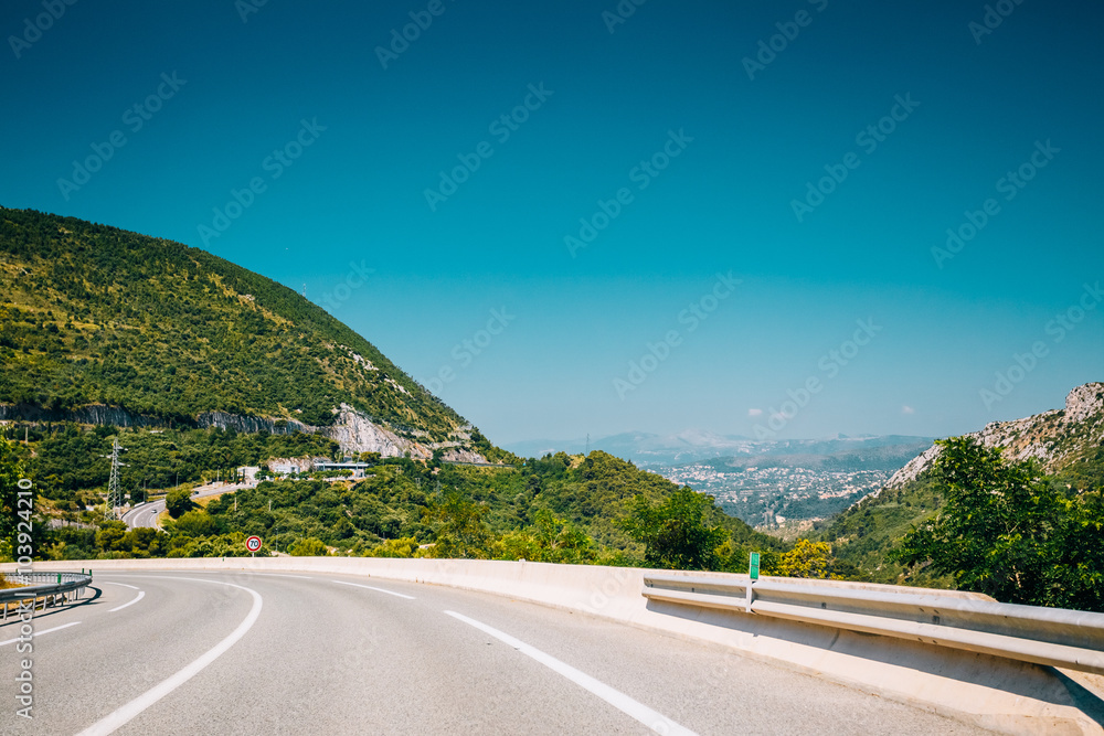 Beautiful asphalt road, freeway, motorway, highway under sunny b Beautiful asphalt road, freeway, motorway, highway under sunny b
