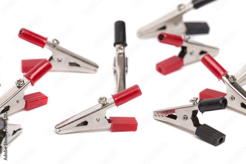 Alligator clippers on a white background. Alligator clippers on a white background.