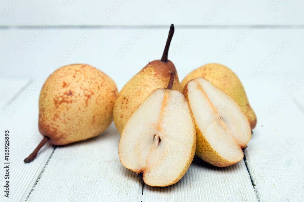 Fresh tasty yellow pear fruits isolated on a white background. Fresh tasty yellow pear fruits isolated on a white background.