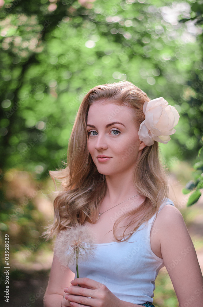 Beautiful girl with a dandelion in the hand Beautiful girl with a dandelion in the hand